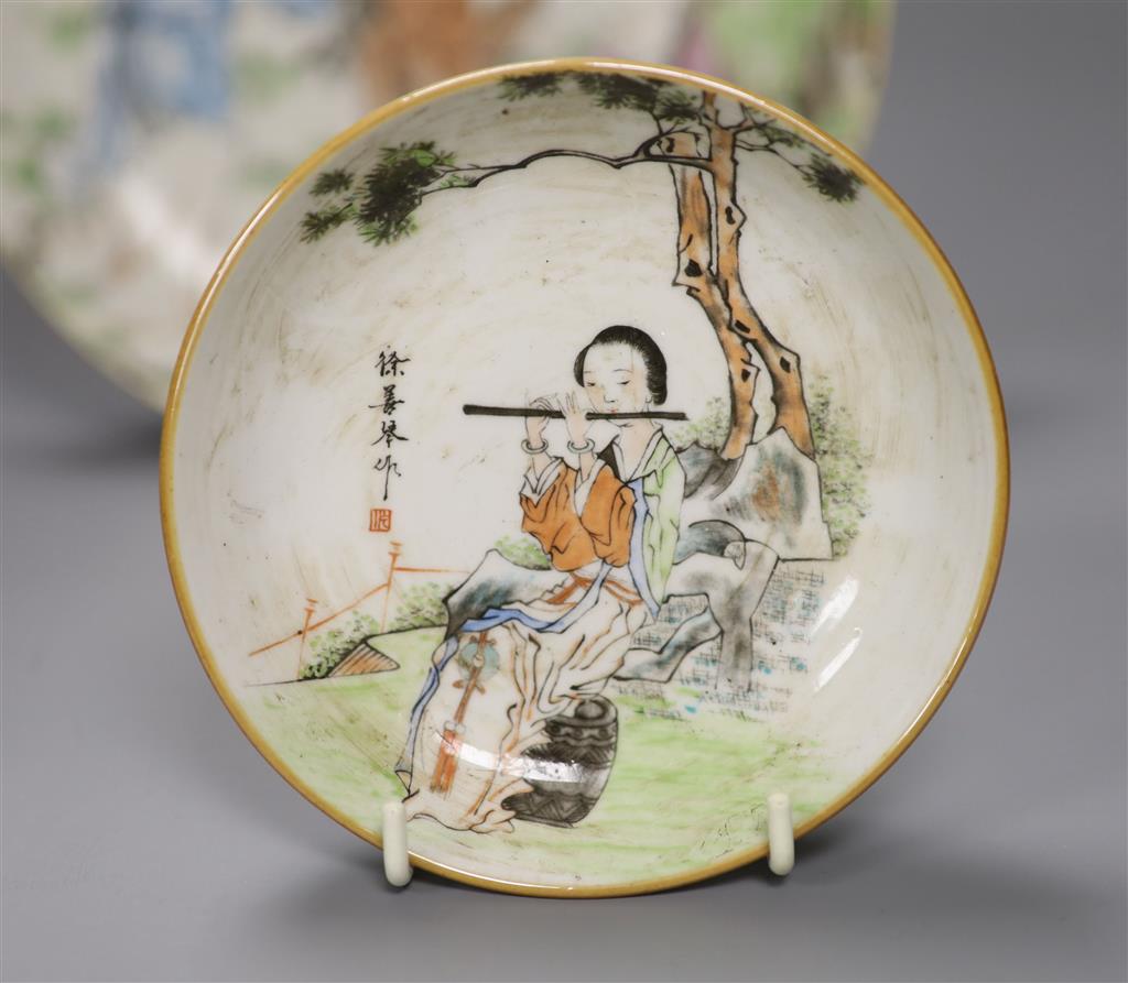 A large Chinese famille rose saucer dish and two similar small dishes, diameter of largest 22.5cm